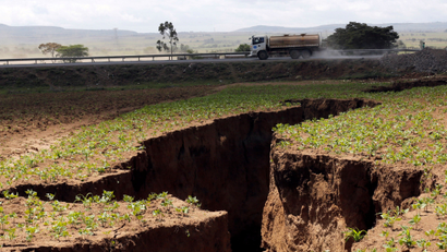 A tanker drives near a chasm suspected to have been caused by a heavy downpour along an underground fault-line near the Rift Valley town of Mai-Mahiu, Kenya March 28, 2018. Picture taken March 28, 2018.