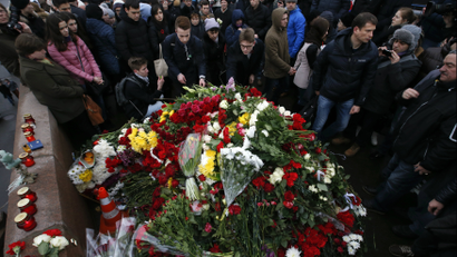 People gather at the site where Boris Nemtsov was recently murdered in central Moscow, February 28, 2015.
