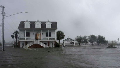 High winds and water surround a house as Hurricane Florence hits Swansboro N.C., Friday, Sept. 14, 2018. (AP Photo/Tom Copeland)
