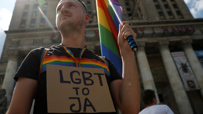 Pawel Szamburski, 29, participates in the protest against violence that took place against the LGBT community during the first pride march in Bialystok earlier this month, in Warsaw, July 27, 2019. The banner reads ''LGBT is me'
