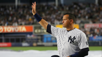 The baseball player Alex Rodriguez waving to fans on the day of his final game.
