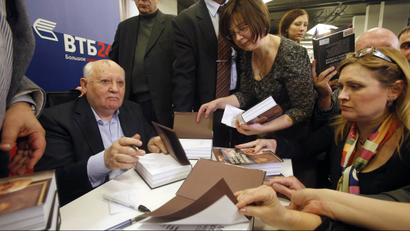 Mikhail Gorbachev signing books