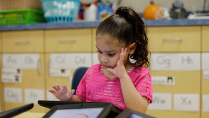 A Pre-K student uses an electronic tablet at the South Education Center, in San Antonio. (AP Photo/Eric Gay)