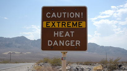 A sign warns of extreme heat in Death Valley