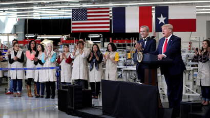 U.S. President Donald Trump speaks next to Louis Vuitton's Chairman and CEO of Luxury goods group LVMH Bernard Arnault during his visit to the Louis Vuitton Rochambeau Ranch leather workshop in Texas.