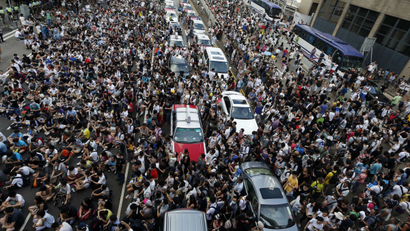 Tens of thousands of protesters block traffic on the main road leading to the financial Central district outside the government headquarters in Hong Kong September 28, 2014.