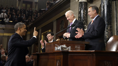 President Barack Obama gestures toward Vice President Joe Biden and House Speaker John Boehner of Ohio before giving his State of the Union address.