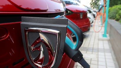 A Baojun E100 all-electric battery car is seen while it is being charged in the parking lot in front of a Baojun NEV Experience Center store in Liuzhou, Guangxi Zhuang Autonomous Region, China, November 8, 2017. Picture taken November 8, 2017.