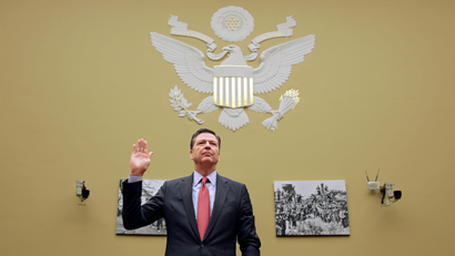 FBI Director Comey is sworn in before testifying before a House Judiciary Committee hearing on "Oversight of the Federal Bureau of Investigation" on Capitol Hill in Washington