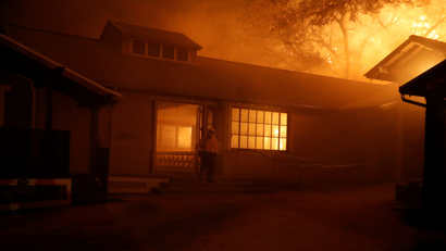Photo of a burning building due to the dangerous Kincade wildfire in northern California