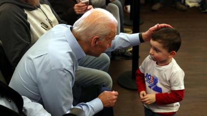 Joe Biden talks to a child at a campaign event