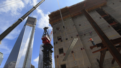 The One World Trade Center building is seen next to construction at the World Trade Center site in New York June 18, 2012. REUTERS/Shannon Stapleton (UNITED STATES - Tags: BUSINESS CONSTRUCTION SOCIETY)