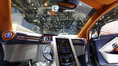 The steering wheel is seen resting in the middle of the dashboard inside a Rinspeed Budii self-driving electric city car during the second press day ahead of the 85th International Motor Show in Geneva