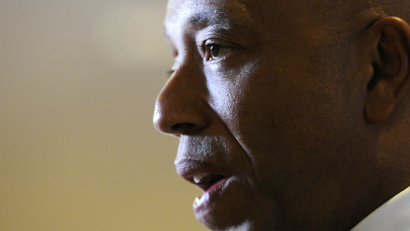 Russell Simmons talks to reporters as he arrives for the 2011 White House Correspondents' Association dinner.