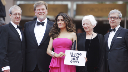 Salma Hayek in Cannes holds #bringbackourgirlssign