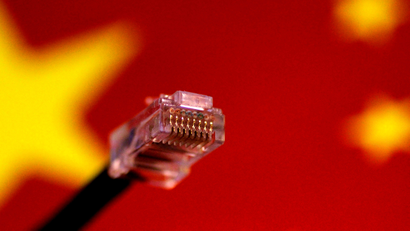 Computer network cable seen above a Chinese flag.