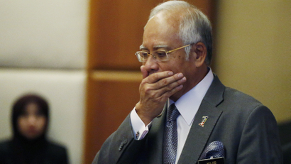 Malaysia's Prime Minister Najib Razak arrives at a presentation for government interns at the Prime Minster's office in Putrajaya, Malaysia, July 8, 2015. Malaysian police raided the office of troubled state investment fund 1MDB on Wednesday, following a report that claimed investigators looking into the firm found nearly $700 million had been transferred to Prime Minister Najib Razak's bank account. Najib has denied taking any money from 1MDB or any other entity for personal gain, and is considering legal action. REUTERS/Olivia Harris TPX IMAGES OF THE DAY - GF10000152317