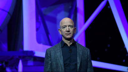 Amazon CEO Jeff Bezos looks a little blue while unveiling his new spaceship.