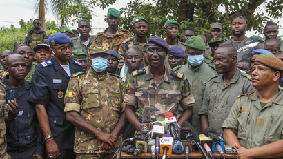 Colonel-Major Ismael Wague, centre, spokesman for the soldiers identifying themselves as National Committee for the Salvation of the People, speaks during a press conference at Camp Soudiata in Kati, Mali, Wednesday, Aug. 19, 2020.
