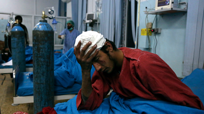 An injured man receives treatment at a hospital after a suicide bombing in Kabul, Afghanistan, Nov. 20, 2018. Afghan officials said the suicide bomber targeted a gathering of Muslim religious scholars in Kabul, killing tens of people. A Public Health Ministry spokesman said another 60 people were wounded in the attack, which took place as Muslims around the world marked the birthday of the Prophet Mohammad.