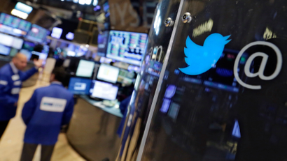 The logo for Twitter adorns a phone post on the floor of the New York Stock Exchange, Tuesday, July 28, 2015. Twitter surprised investors with a strong earnings report Tuesday even as the company searches for a permanent CEO and faces ongoing challenges growing its user base. (AP Photo/Richard Drew)