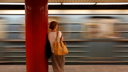 A commuter waits for a train at a subway station in Budapest.