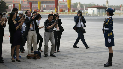 Journalists take photos in Tiananmen Square