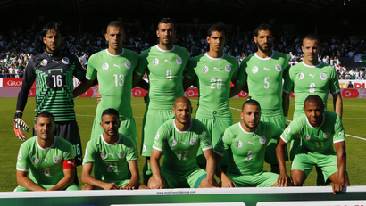 Algeria's World Cup squad lines up for a photo before a match.