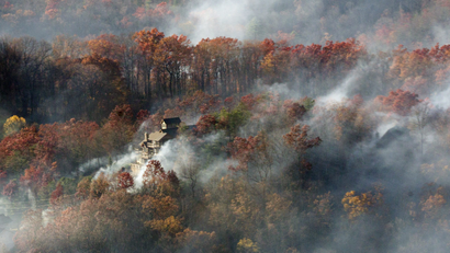 Smoke from a deadly wildfire engulfs a home near Gatlinburg, Tennessee.