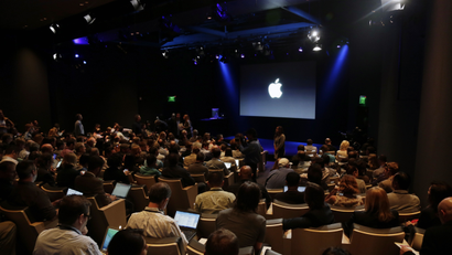 Attendees wait for the start of an event at Apple headquarters on Thursday, Oct. 16, 2014 in Cupertino, Calif. (AP Photo/Marcio Jose Sanchez)