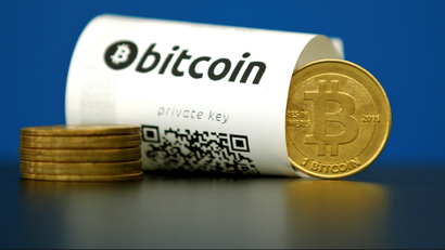 A bitcoin paper wallet with QR codes and a coin