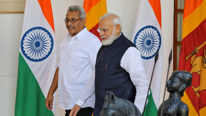 Sri Lanka's President Rajapaksa and India's PM Modi arrive for a photo opportunity ahead of their meeting at Hyderabad House in New Delhi
