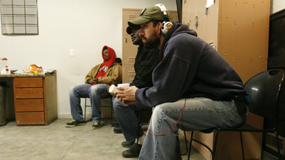 Workers, some who've been laid off or can't find jobs in the oil industry, wait for temporary assignments at the Command Center temporary staffing agency in Williston, North Dakota.