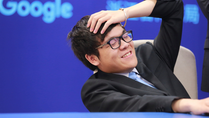 Chinese Go player Ke Jie reacts during his second match against Google's artificial intelligence program AlphaGo at the Future of Go Summit in Wuzhen, Zhejiang province, China May 25, 2017. REUTERS/Stringer ATTENTION EDITORS - THIS IMAGE WAS PROVIDED BY A THIRD PARTY. EDITORIAL USE ONLY. CHINA OUT. - RTX37IUF