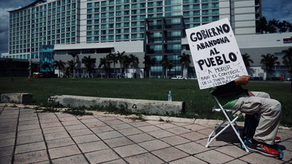 A Puerto Rican protests near the convention center when the Financial Oversight and Management board met last year.