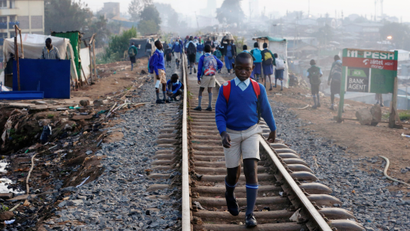 A schoolboy walks along the Kenya-Uganda railway line in January.