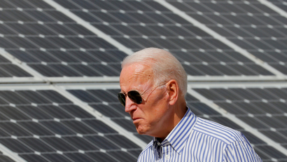 Joe Biden walks past solar panels while touring the Plymouth Area Renewable Energy Initiative in Plymouth, New Hampshire, U.S., June 4, 2019.