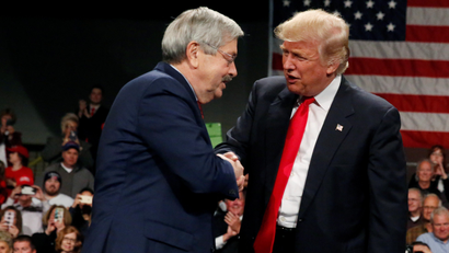 U.S. President-elect Donald Trump shakes hands with Governor of Iowa Terry Branstad (L) at the USA Thank You Tour event at the Iowa Events Center in Des Moines, Iowa, U.S., December 8, 2016. REUTERS/Shannon Stapleton - RTSVBNQ