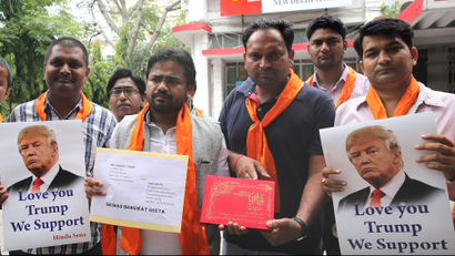 Indian activists from the right-wing organization Hindu Sena hold a Hindu holy book before sending it to US Republican Presidential nominee Donald Trump.