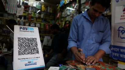 A QR code of Paytm is seen at a mobile repairing shop in Kolkata