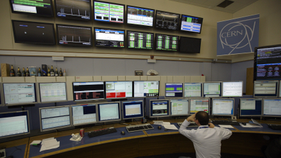 A technician looks at computer screens during the preparation of the beam in the Control Room of the Large Hadron Collider (LHC) at the European Organisation for Nuclear Research (CERN) near Geneva April 5, 2012. At 0:38 CEST this morning, the LHC shift crew declared "stable beams" as two 4 TeV proton beams were brought into collision at the LHC's four interaction points. The collision energy of 8 TeV is a new world record, and increases the machine's discovery potential considerably.