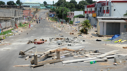 Barricades are seen on a street following an election protest in Libreville,