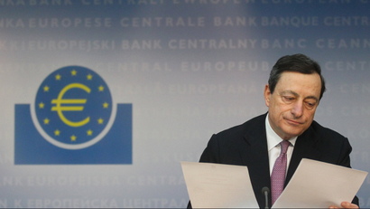 The European Central Bank (ECB) President Mario Draghi checks papers during the monthly news conference in Frankfurt.