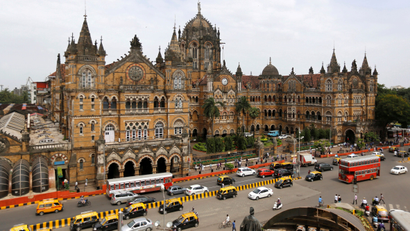 Traffic moves in front of the Chhatrapati Shivaji Terminus railway station in Mumbai