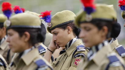 Female police contingent waits for Kashmir's chief minister Omar Abdullah to arrive during India's Independence Day celebrations in Srinagar