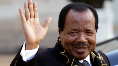 Cameroon's President Paul Biya waves as he leaves following a meeting at the Elysee Palace in Paris, January 30, 2013.