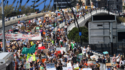 Climate change protesters are seen crossing the Victoria Bridge during the Global Strike 4 Climate rally in Brisbane