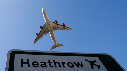plane flying over heathrow