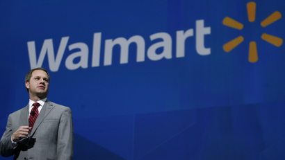 In this June 7, 2013 file photo, Doug McMillon, President and CEO, Wal-Mart International, speaks at the shareholders meeting in Fayetteville, Ark. Wal-Mart Stores on Monday, Nov. 25, 2013 announced that CEO and President Mike Duke is stepping down from those posts, and named McMillon as his successor, effective Feb. 1, 2014.