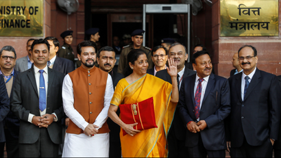 India's Finance Minister Nirmala Sitharaman holds budget papers during a photo opportunity as she leaves her office to present the federal budget in the parliament in New Delhi